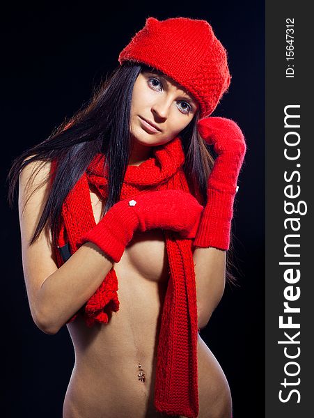 Portrait of young woman with red hat and mitten