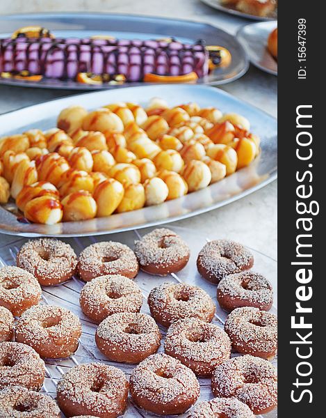 Chocolate doughnut-shaped bread rolls and dried apricots