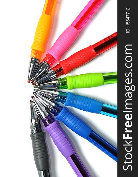 Assortment of colored ball-pen over white