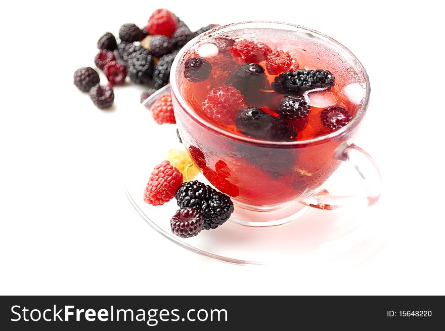 Ripe forest berries in the glass cup