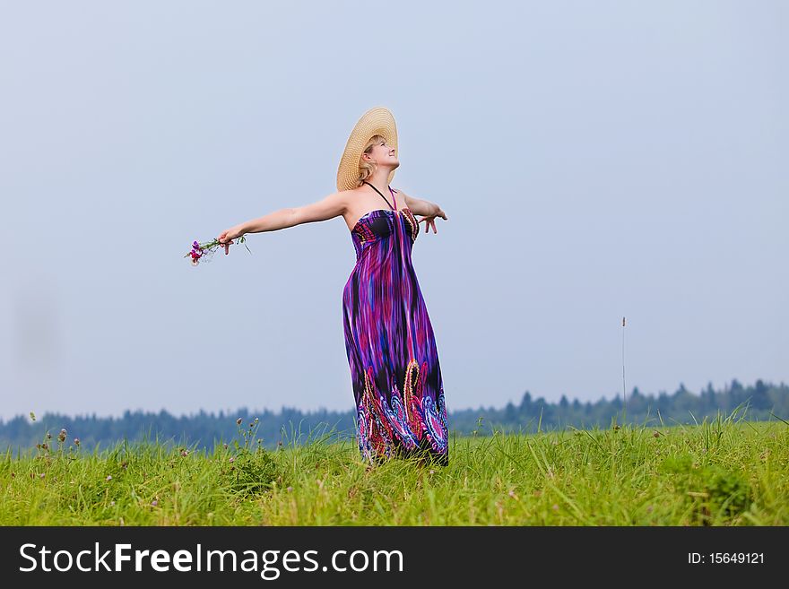 Young beautiful girl on a meadow