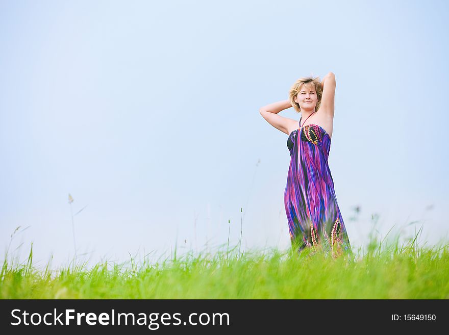 Young beautiful girl on a meadow
