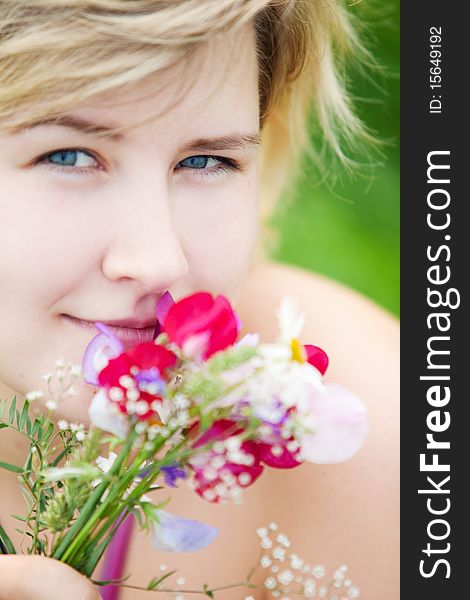 Young beautiful girl on a meadow