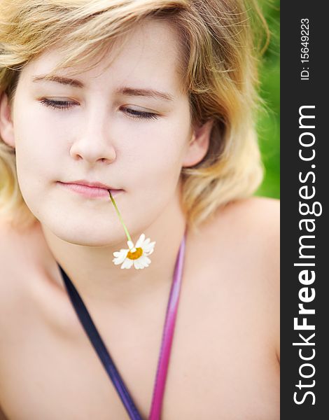 Young beautiful girl on a meadow