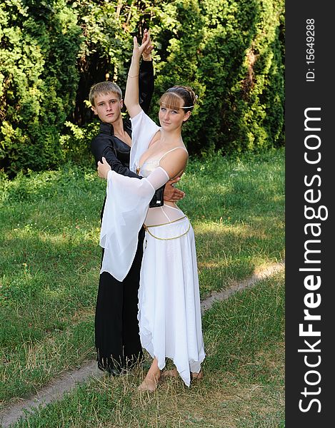 Dancing couple outdoors in park