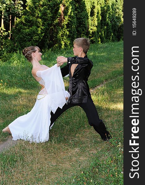 Dancing couple outdoors in park