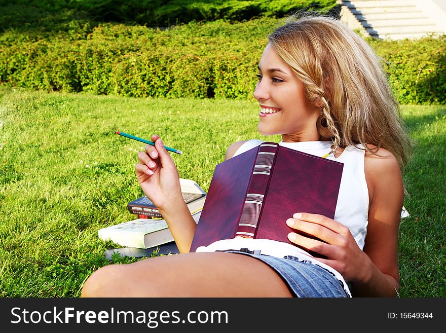 Young And Beautiful Girl Doing Home Work