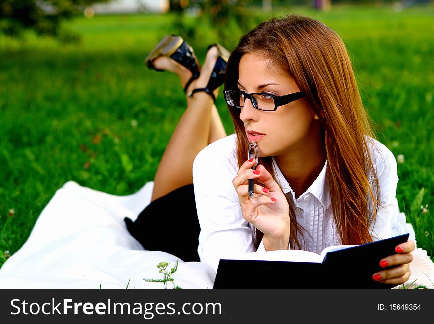 Young and beautiful girl doing home work