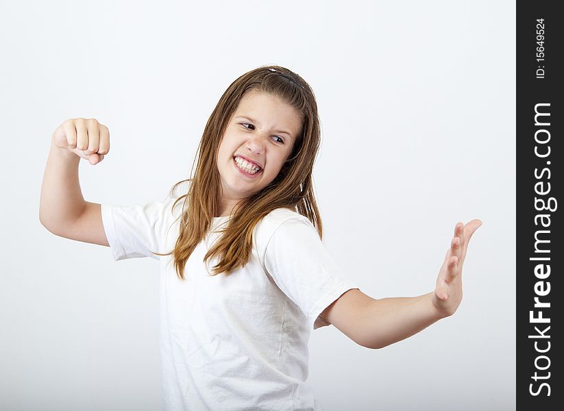 Angry girl prepares to strike open hand with clenched fist. Angry girl prepares to strike open hand with clenched fist.