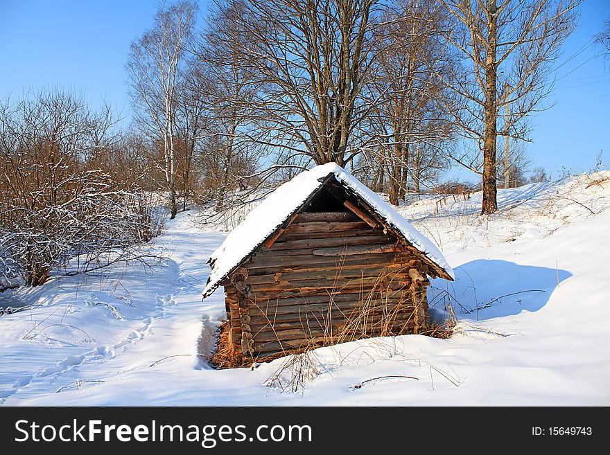 Old rural house amongst snow