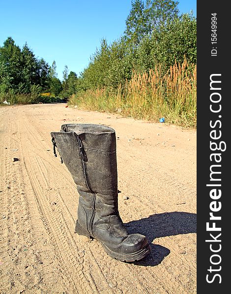 Old boot on rural road