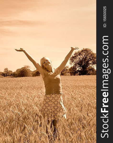 Blond woman in field in France