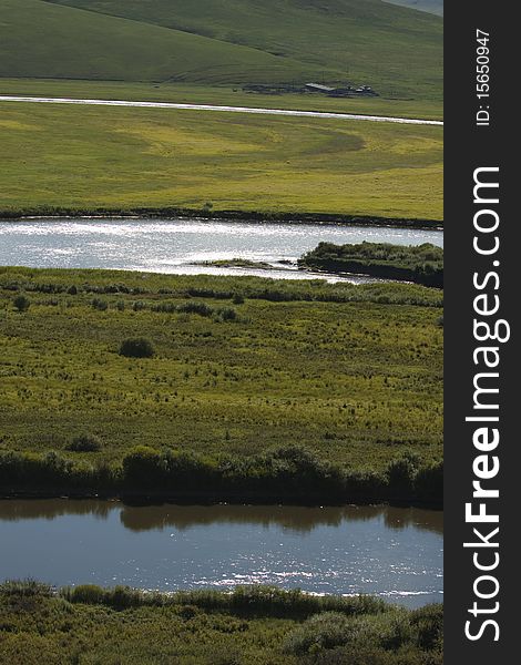 The river in the summer prairies of Inner Mongolia, China. The river in the summer prairies of Inner Mongolia, China