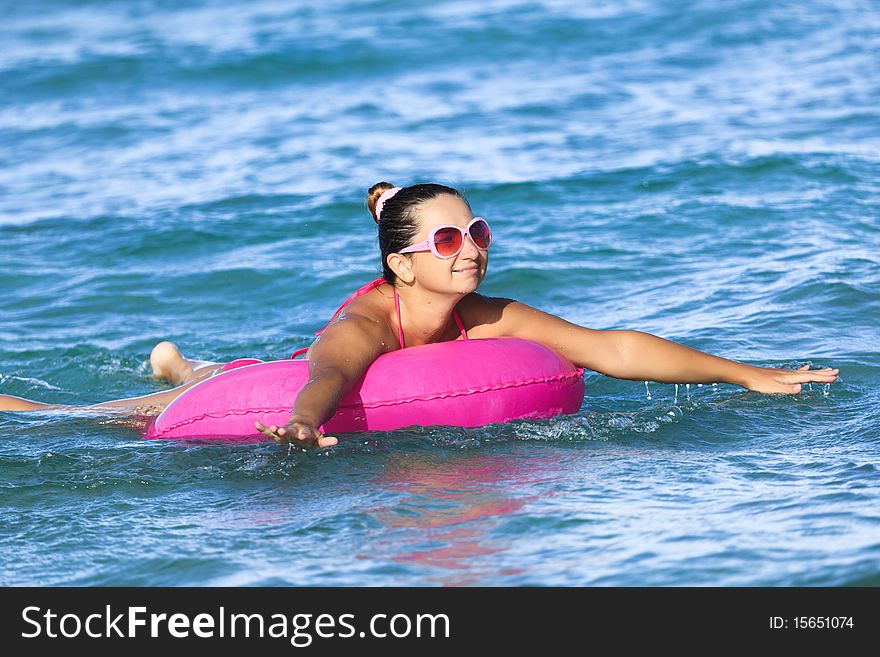 Woman has a fun time on inner tube. Woman has a fun time on inner tube