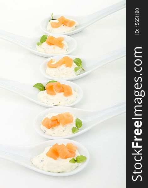 Fingerfood, cheese and salmon with basil