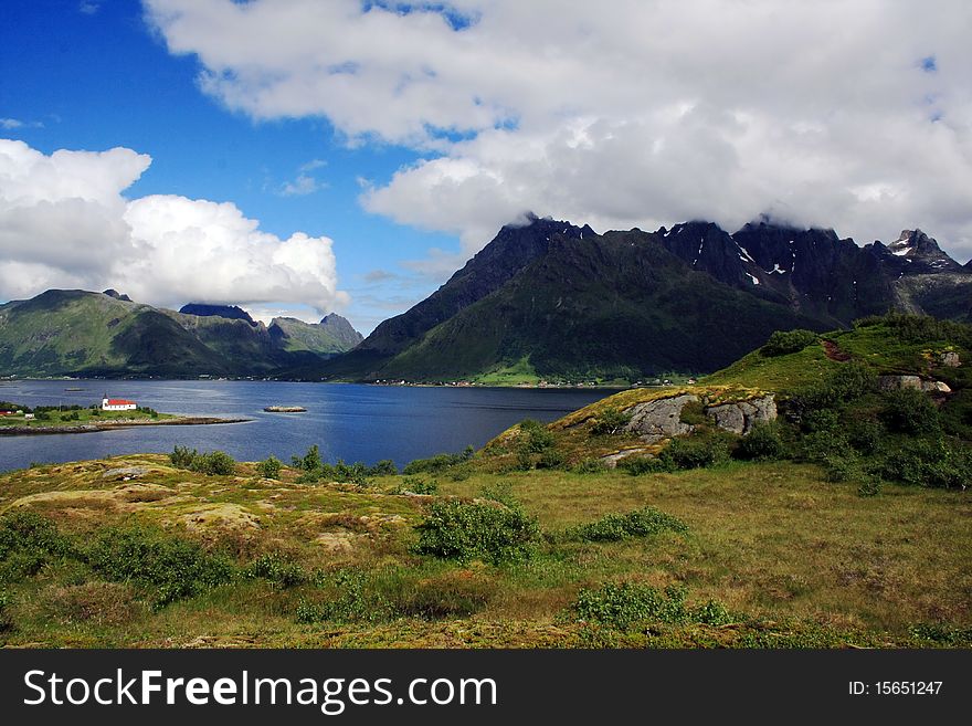 The view on the beauty mountains and lake somewhere in Lofoten islands, Norway. The view on the beauty mountains and lake somewhere in Lofoten islands, Norway