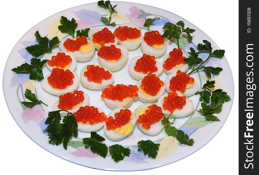 Caviar on quail eggs isolated on white decorated with parsley leaves