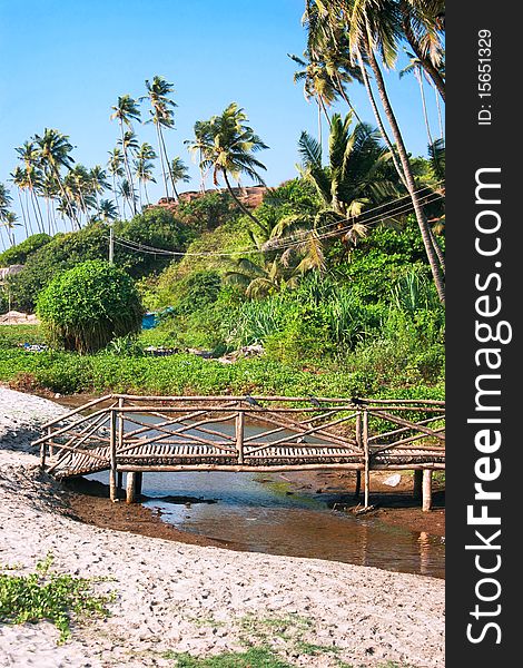 Wooden bridge cross a small river on Goa coast, Goa , India. Wooden bridge cross a small river on Goa coast, Goa , India