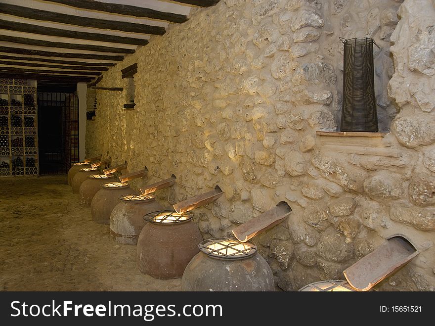 Clay jugs at a wall inside a blacksmith