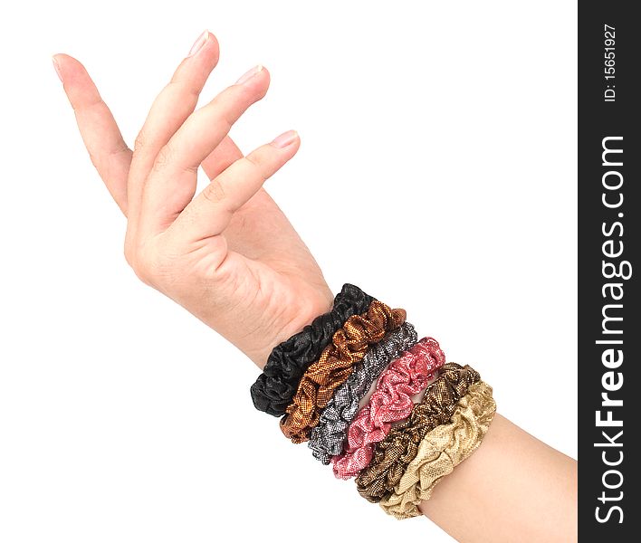 Elastic bands of hair multi-colored on a hand on a white background