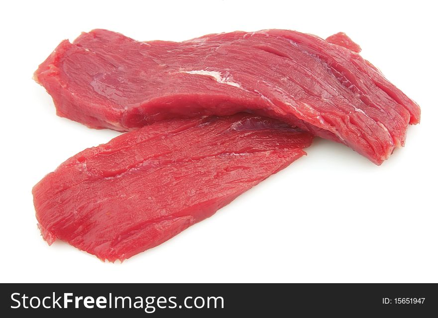 Two slices fresh beef meat on a white background