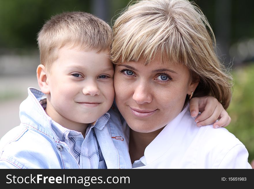 Happy mother and her little son outdoors session. Happy mother and her little son outdoors session