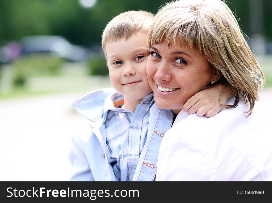 Happy mother and her little son outdoors session. Happy mother and her little son outdoors session