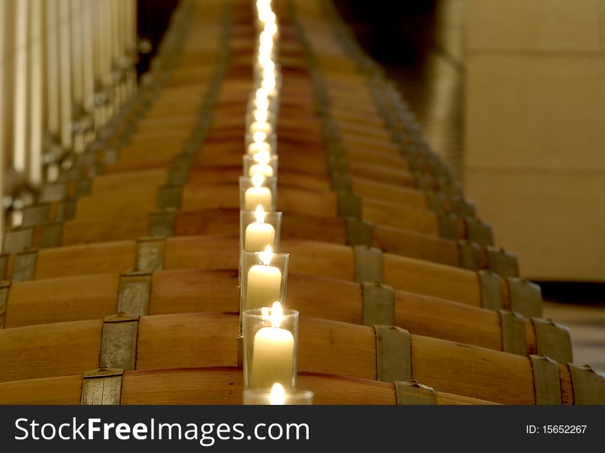 Barrels in rows with candles on top. Barrels in rows with candles on top