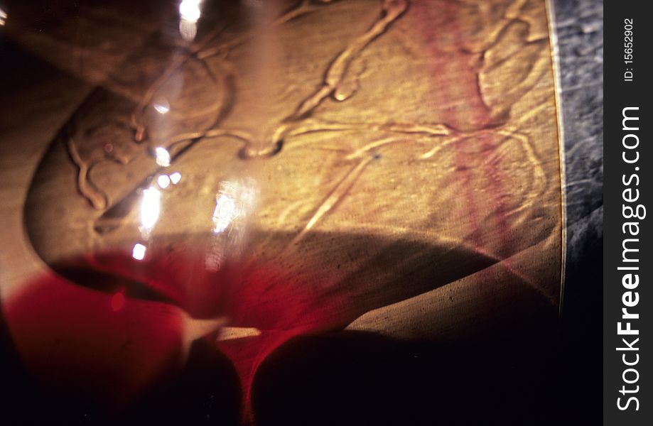 Reflection of light in a red wine glass