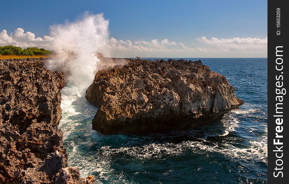 Water breaks over rocks at the indian ocean. Water breaks over rocks at the indian ocean