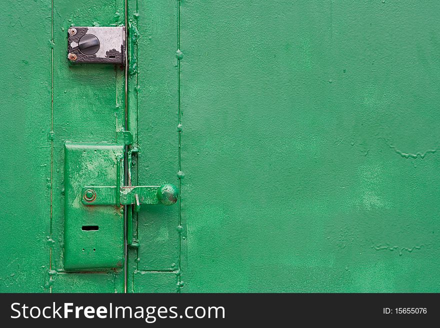 Door lock on the valve metal gate. Texture, background. Door lock on the valve metal gate. Texture, background