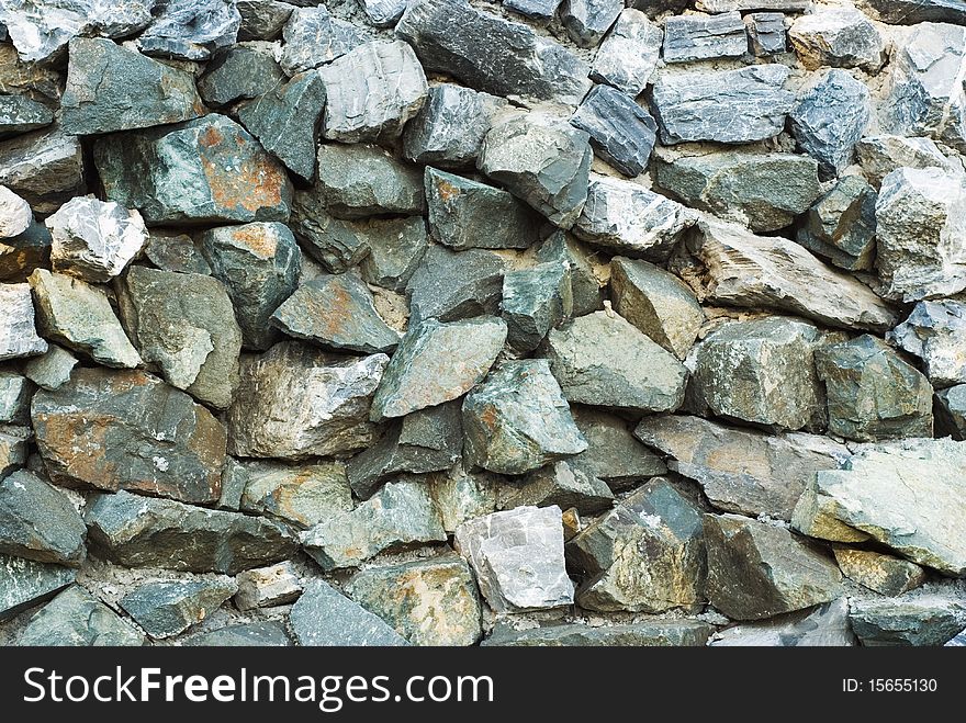 Wall of natural stone, background