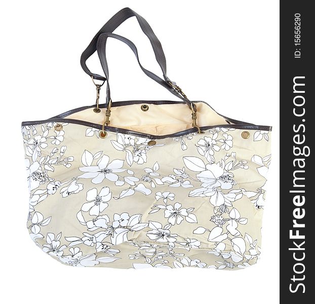 Female beachbag decorated with flowers. Isolated white background. Female beachbag decorated with flowers. Isolated white background