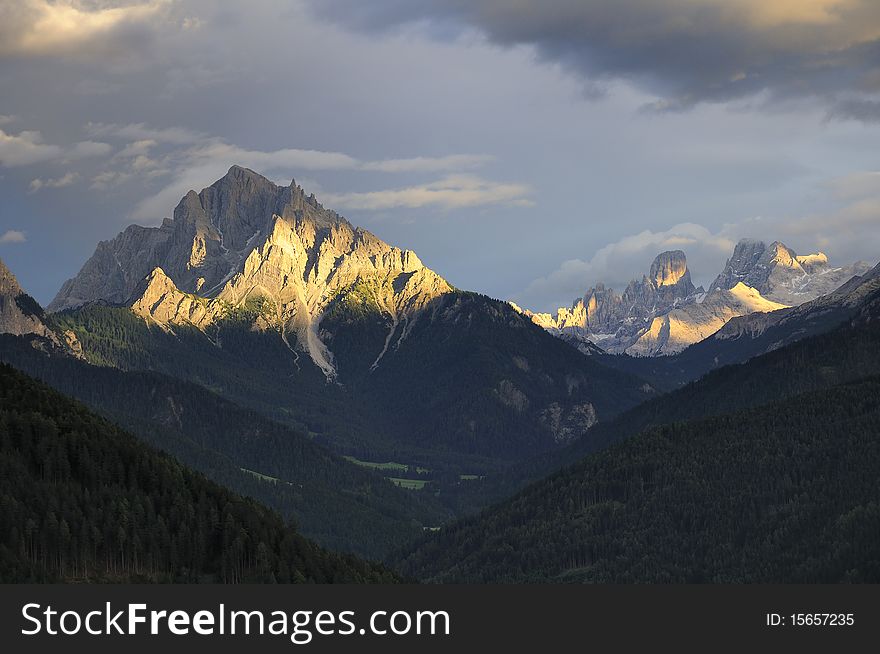 A ray of sun says goodbye to a Mountain into Italian Dolomites. A ray of sun says goodbye to a Mountain into Italian Dolomites