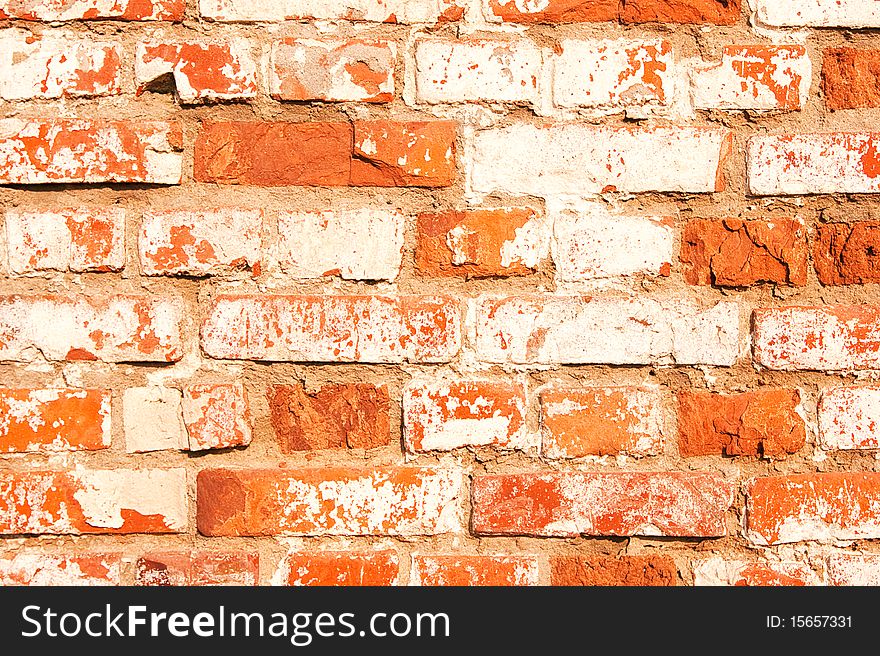 The facade view of the old brick wall for design background.