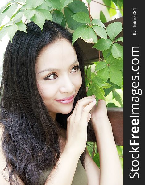 Beautiful girl with long hair in the garden.(taken in August). Beautiful girl with long hair in the garden.(taken in August)