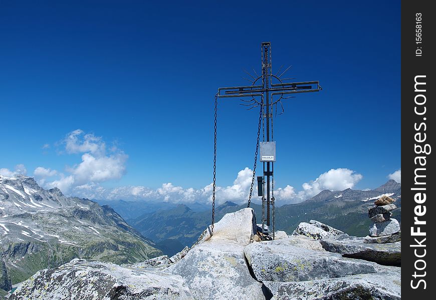 Cross standing on top of one of the alpine mountains. Cross standing on top of one of the alpine mountains