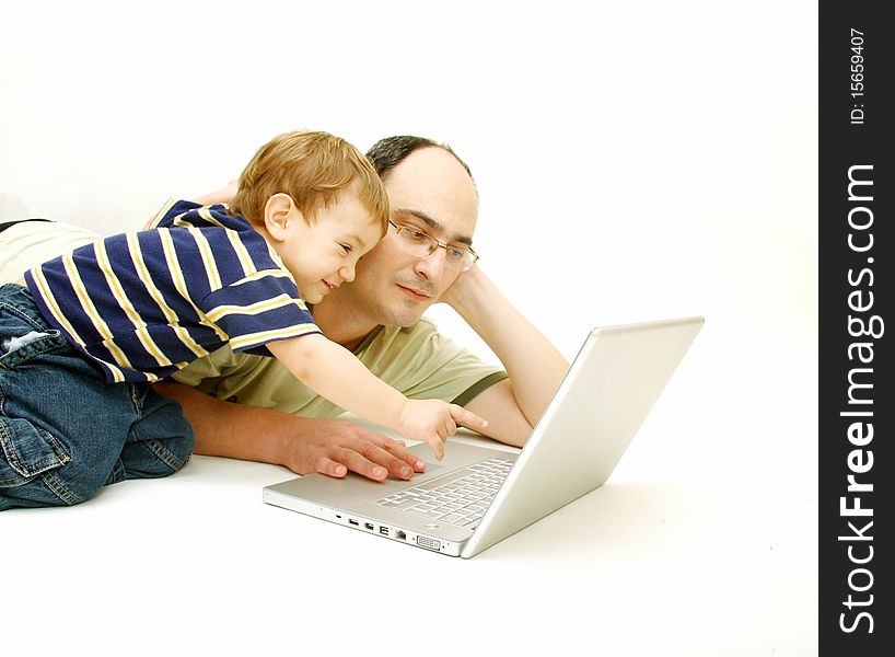 Father and son with laptop over white