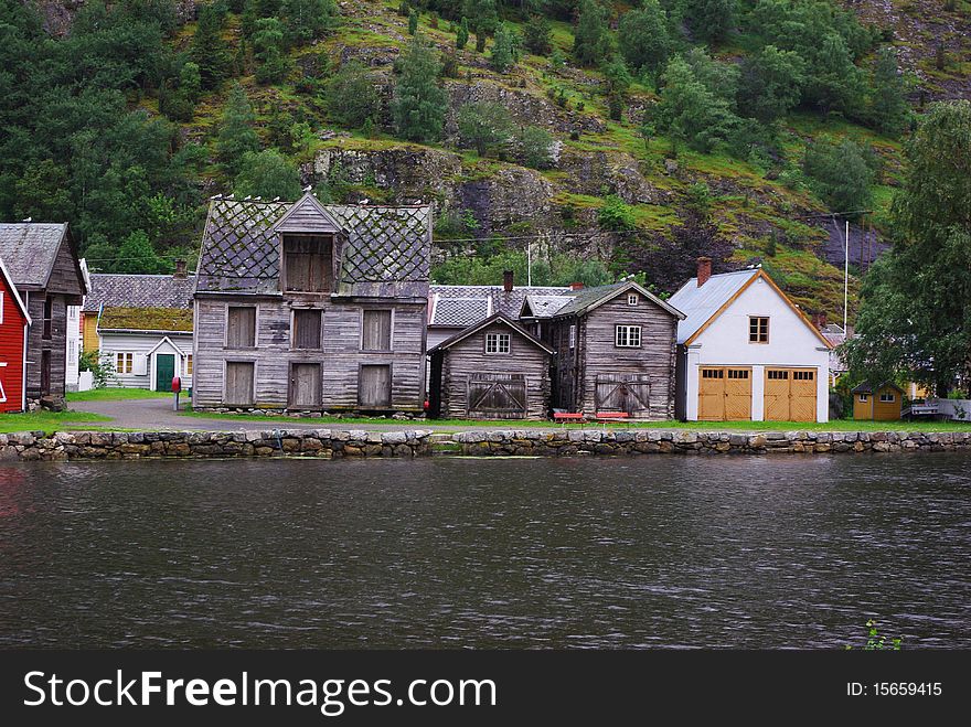 Traditional wooden houses on hillside background in Lyrdal, Norway. Traditional wooden houses on hillside background in Lyrdal, Norway