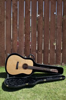 Guitar In Case Against A Fence Stock Image Guitar In Case Against A Fence Stock Image