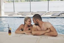 Happy Cople Relaxing At Swimming Pool Stock Images Happy Cople Relaxing At Swimming Pool Stock Images