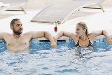 Happy Cople Relaxing At Swimming Pool Royalty Free Stock Images Happy Cople Relaxing At Swimming Pool Royalty Free Stock Images