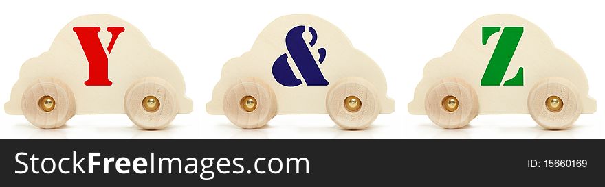 Set of wooden car alphabet toys over white background. Y & Z. Set of wooden car alphabet toys over white background. Y & Z