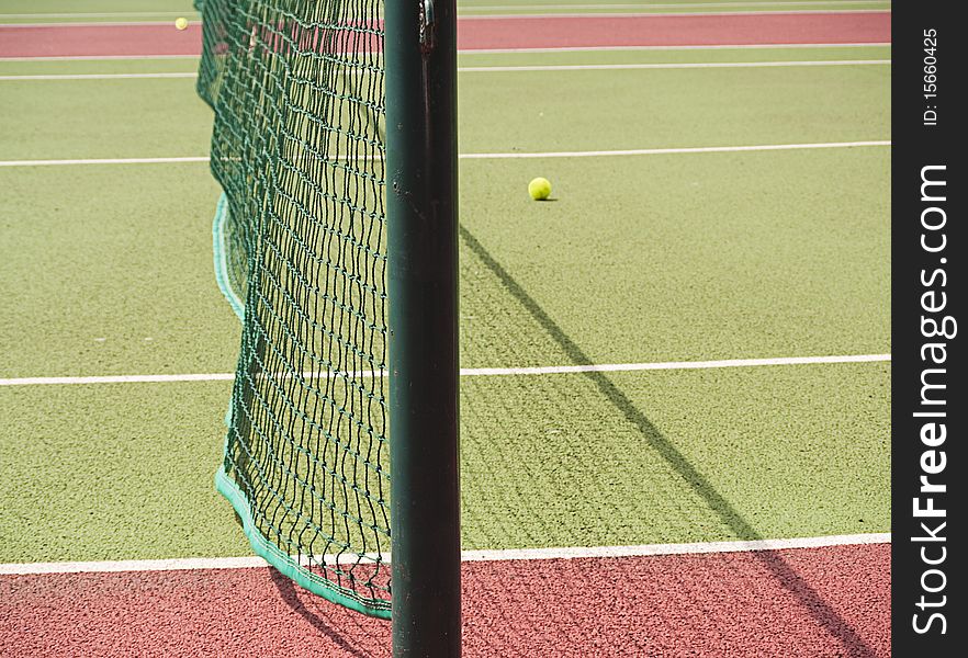 Close-up of tennis net and court