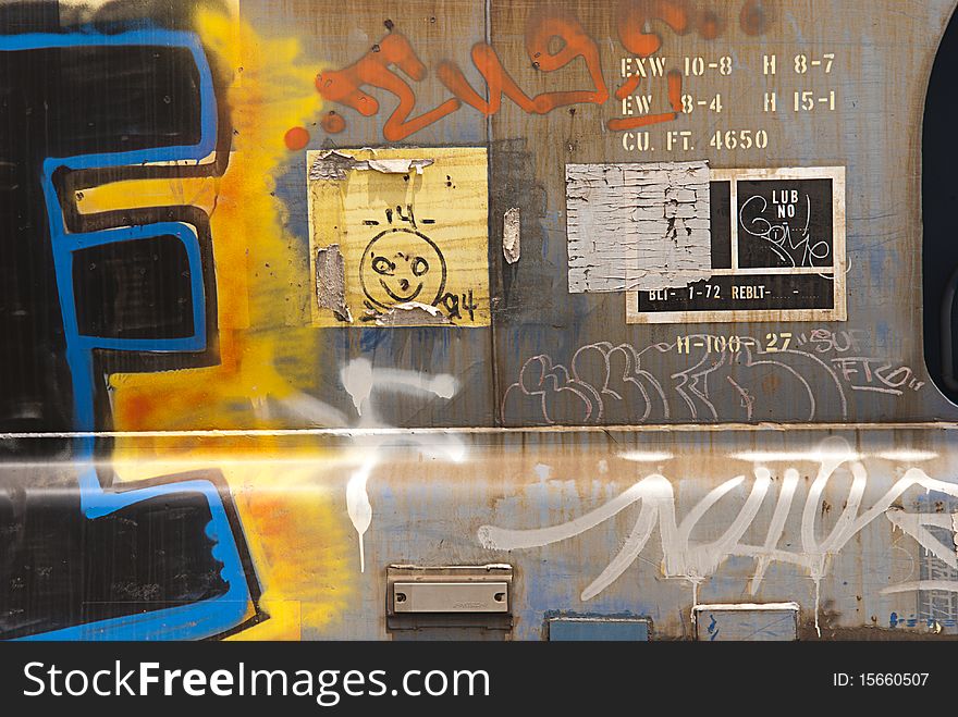 Close-up of metal panels on railroad wagon covered in graffiti. Close-up of metal panels on railroad wagon covered in graffiti