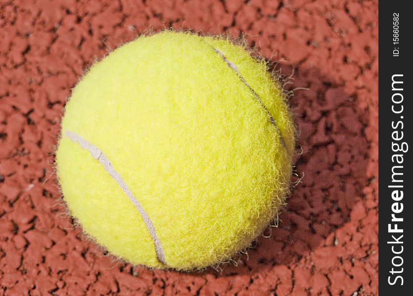 Tennis ball on hard court surface. Tennis ball on hard court surface