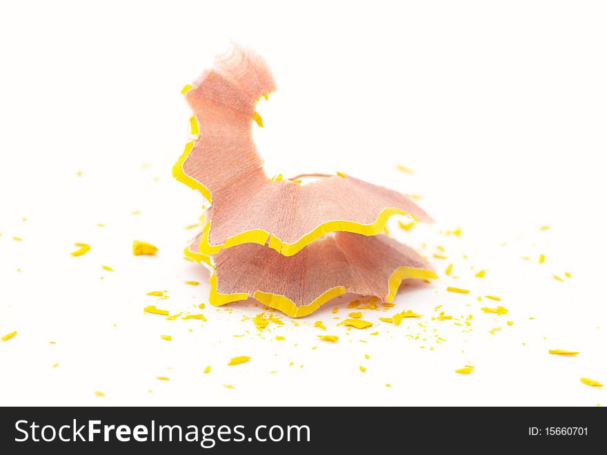 Yellow pencil shavings isolated on white