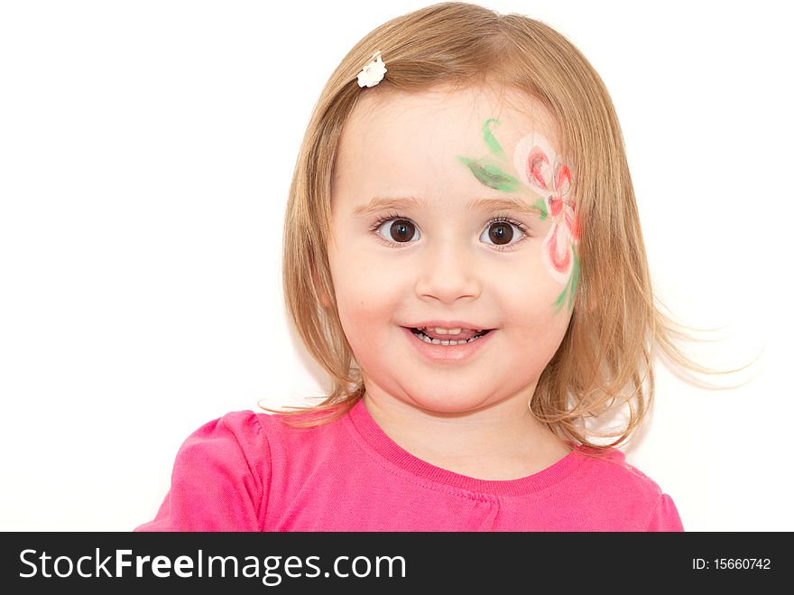Smiling little girl with face-art isolated on white
