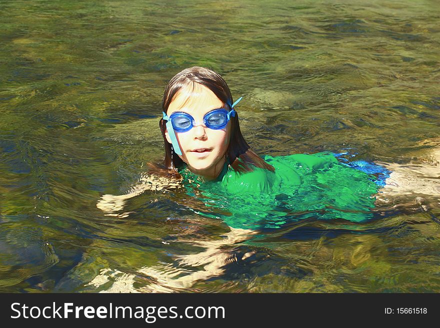 Girl enjoying the river water