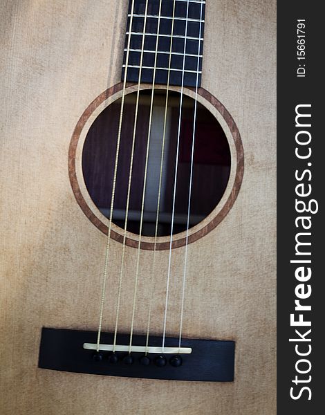 This is an acoustic guitar bridge and sound hole